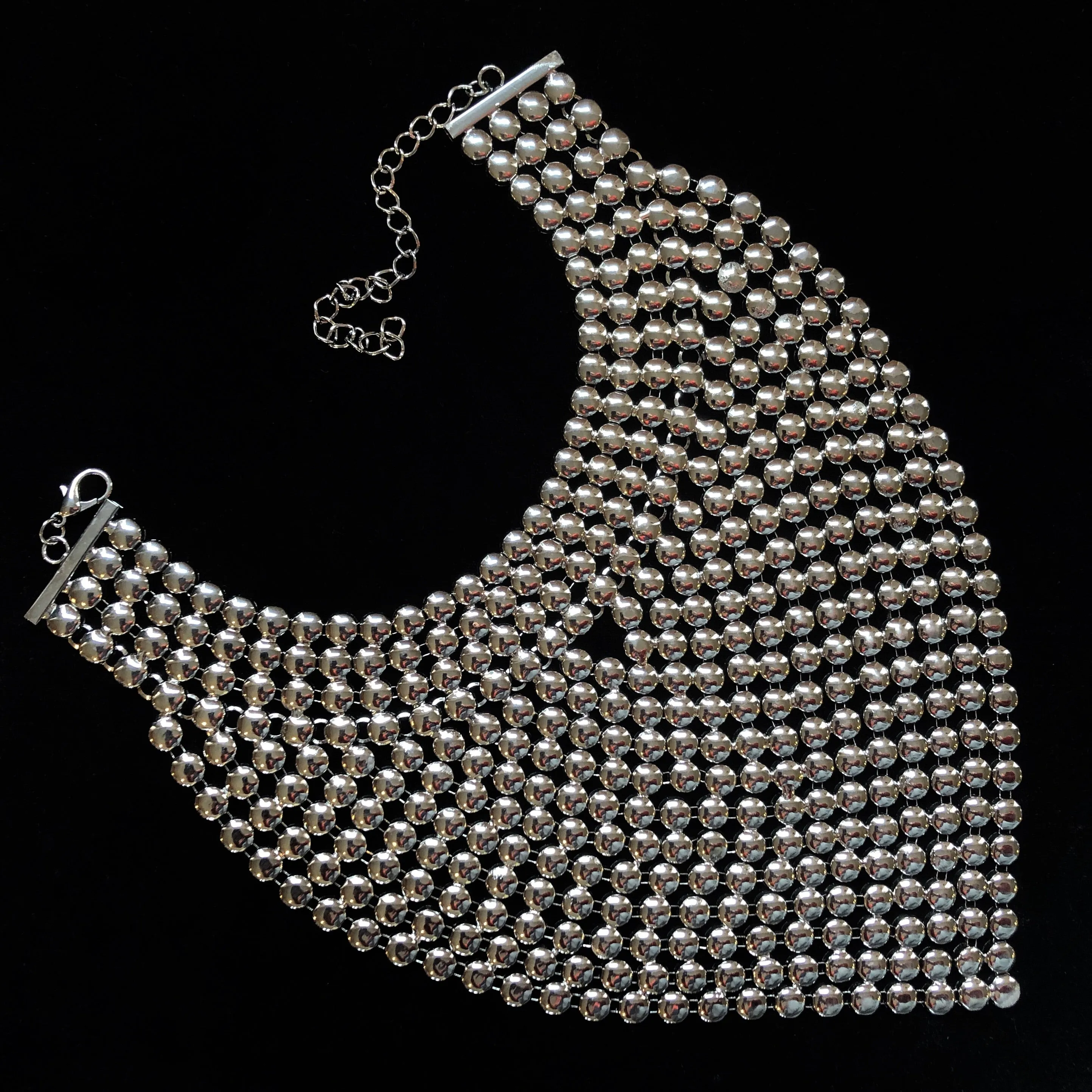 A CHROME GLADIATOR STYLE NECKPIECE