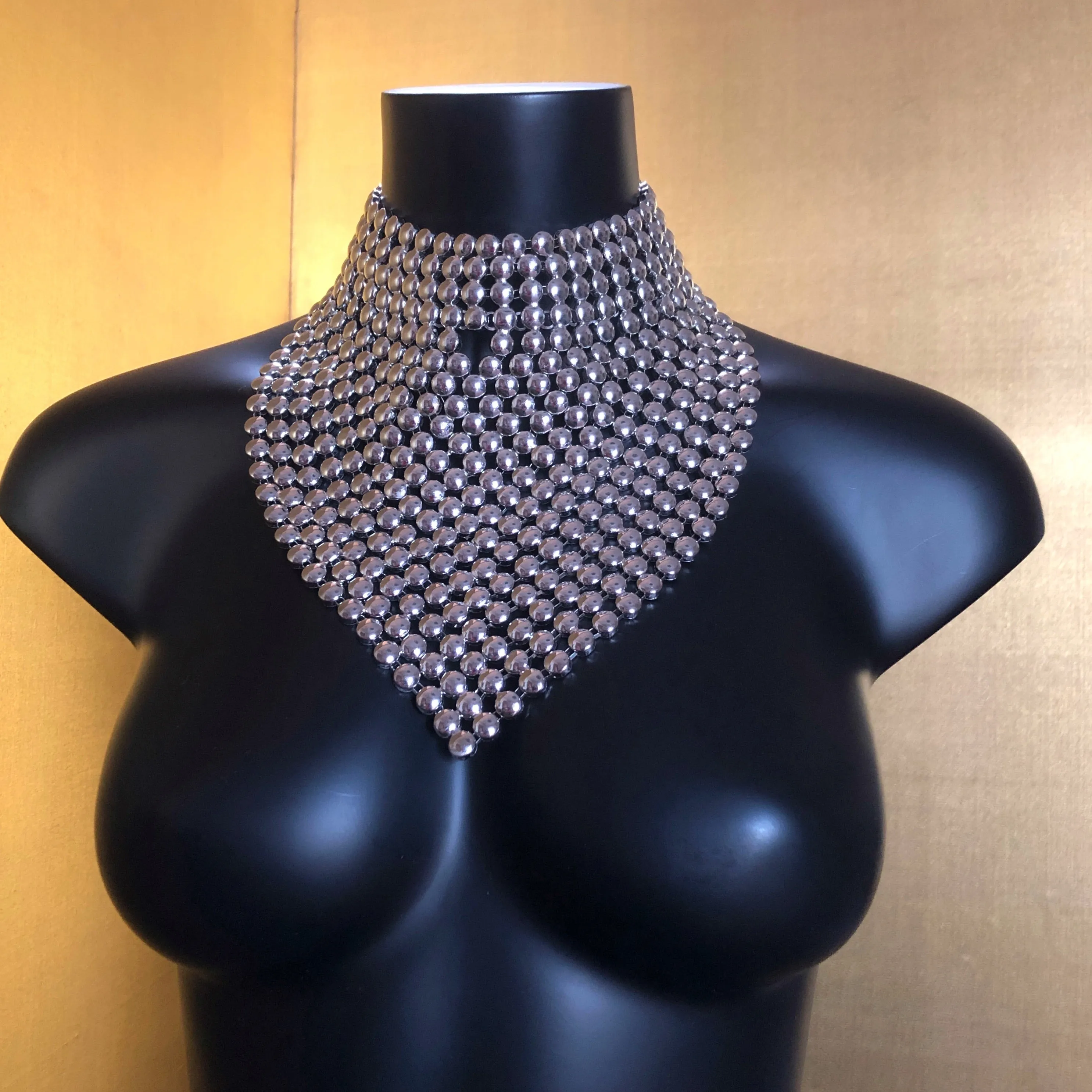 A CHROME GLADIATOR STYLE NECKPIECE