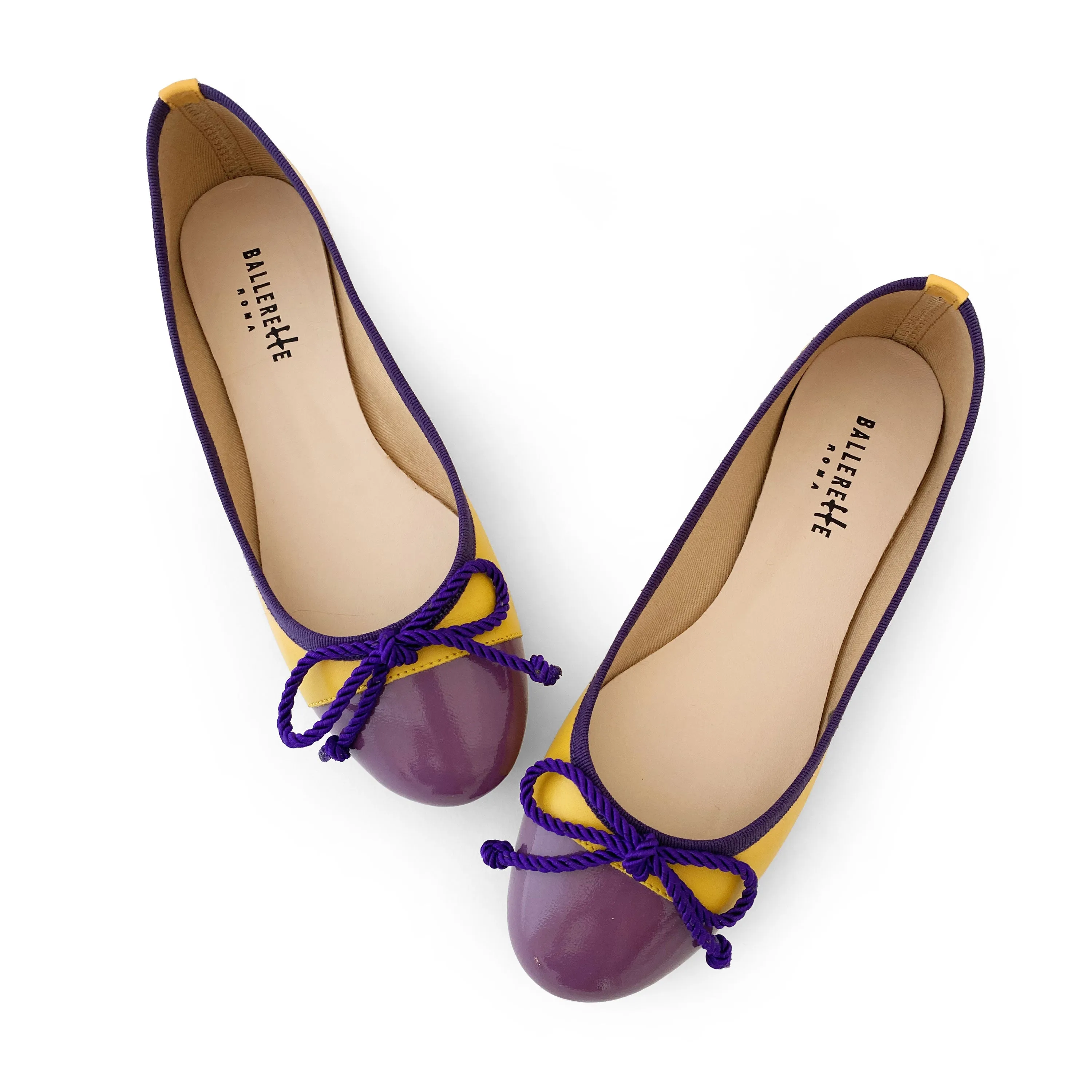 Yellow leather ballet flats with purple toe and bow