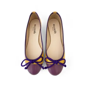 Yellow leather ballet flats with purple toe and bow